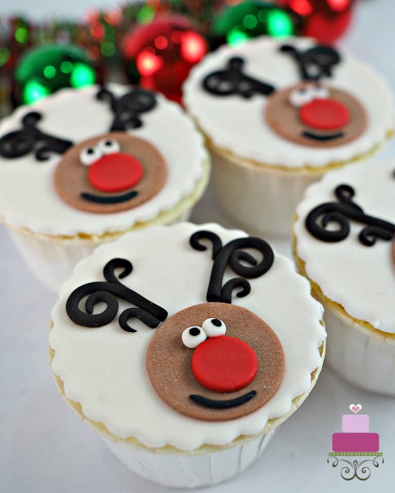 4 cupcakes with reindeer face decoration.
