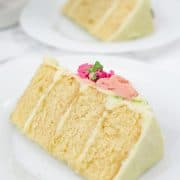 2 slices of 4-layer cake on white plates