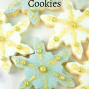 Blue and white snowflake cookies decorated in gold.