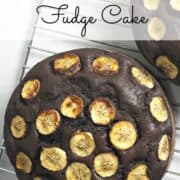 A round chocolate banana cake topped with caramelized banana slices
