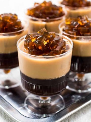 Mini cups with 2 layers of coffee jelly in a mini cup topped with black coffee jelly cubes