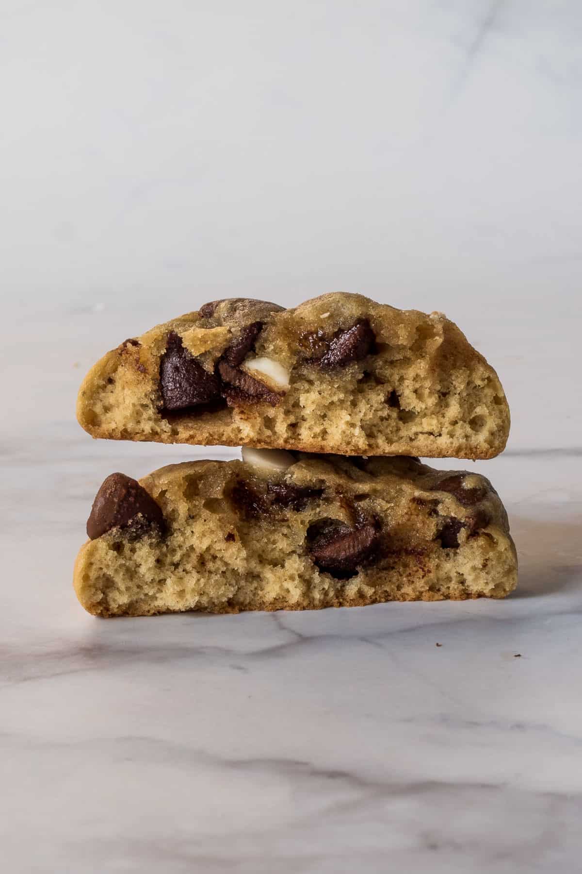 A chocolate chip cookie broken into 2
