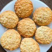 Almond oatmeal cookies arranged on a white plate