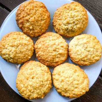 Almond oatmeal cookies arranged on a white plate.