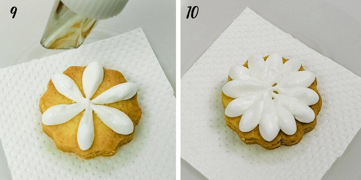 Piping white icing petals on a round cookie.