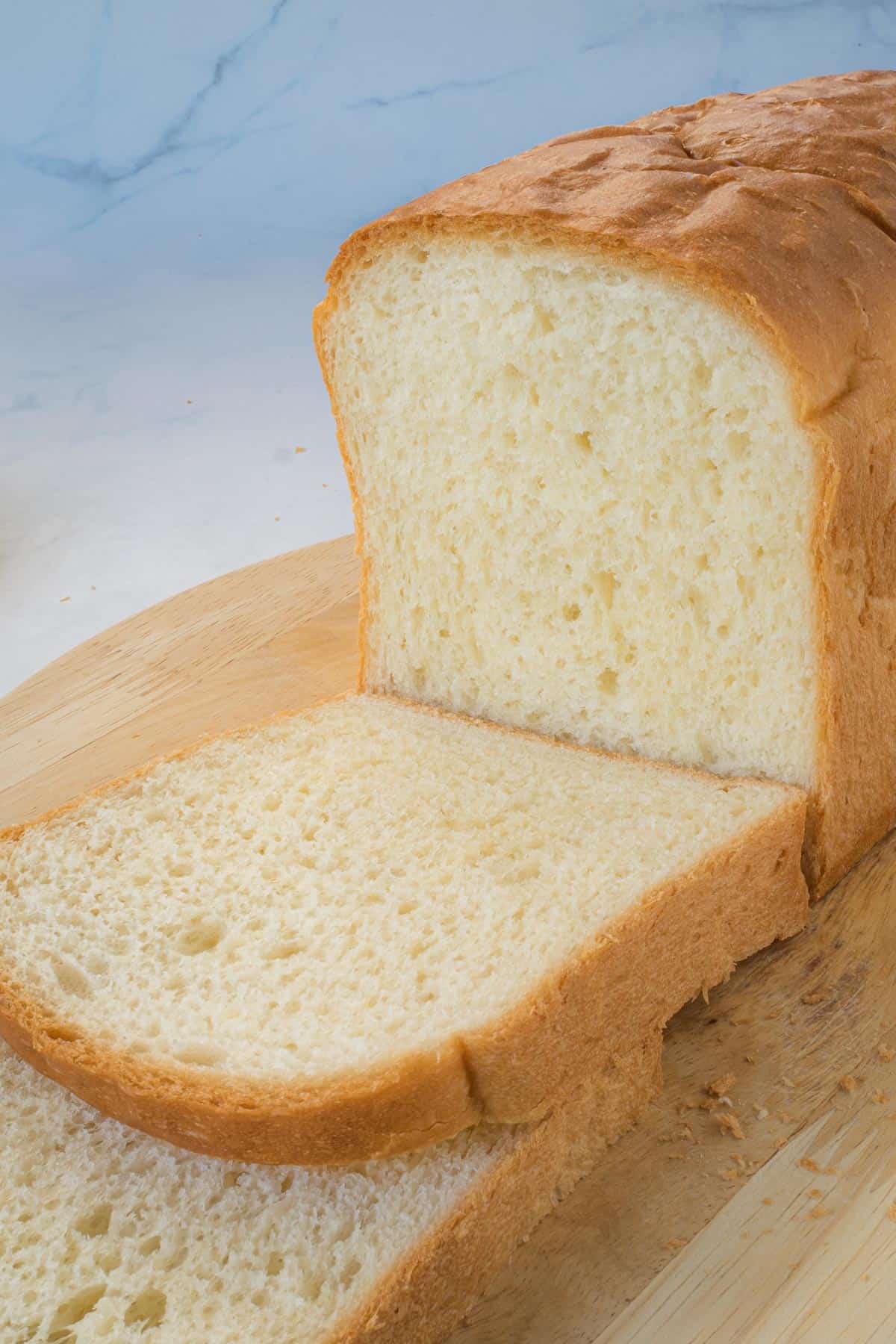 A loaf bread with slice cut out.