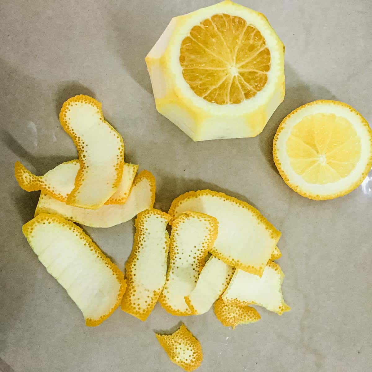 An citrus fruit with its skin cut.