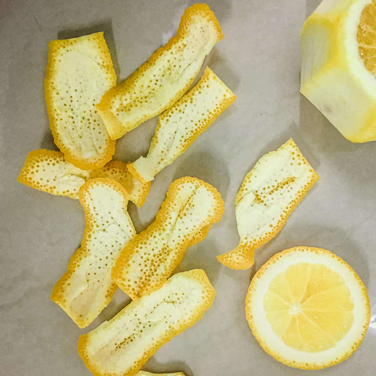 Slices of citrus skin with the white pith removed.
