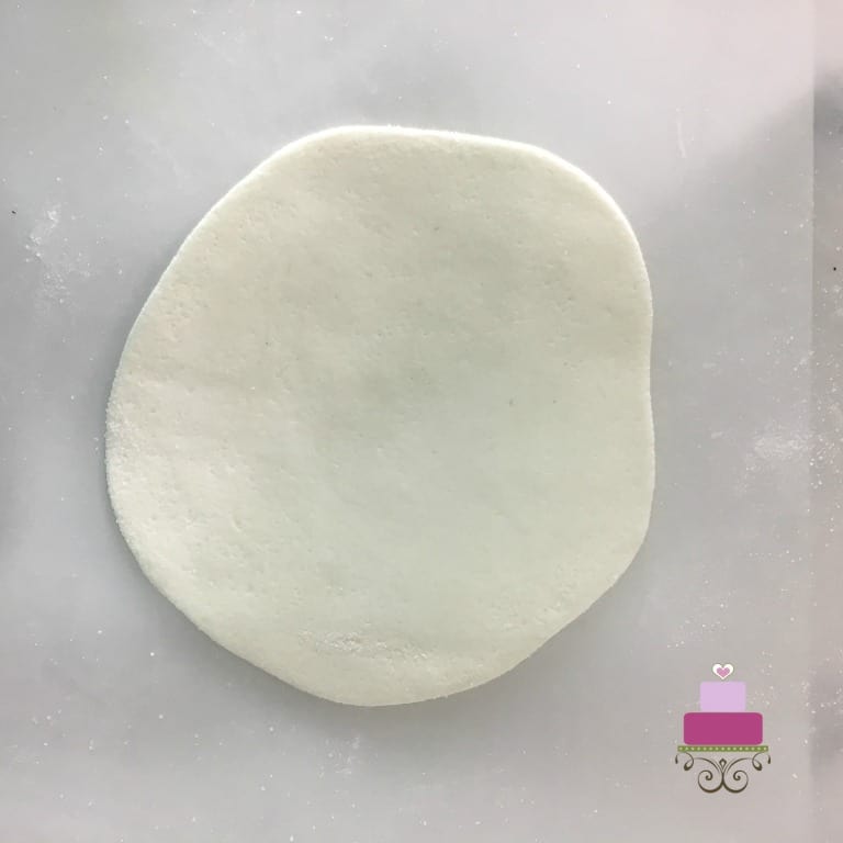 A piece of white rolled fondant.