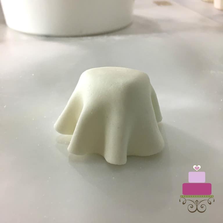 A marshmallow covered in white fondant to look like a ghost