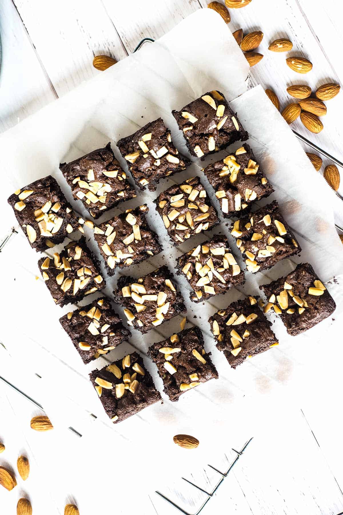 A block of almond brownie cut into 16 squares