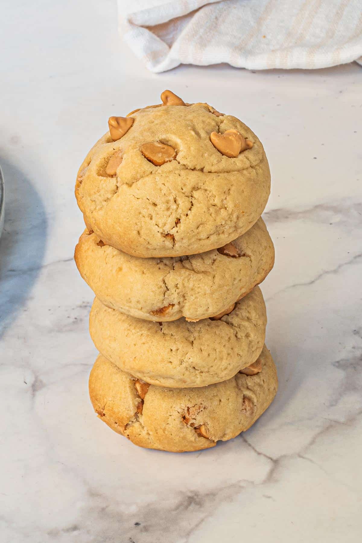 4 peanut butter cream cheese cookies stacked on one another