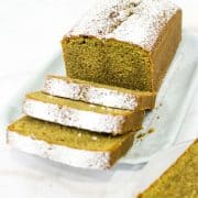 A loaf of green tea cake cut into slices
