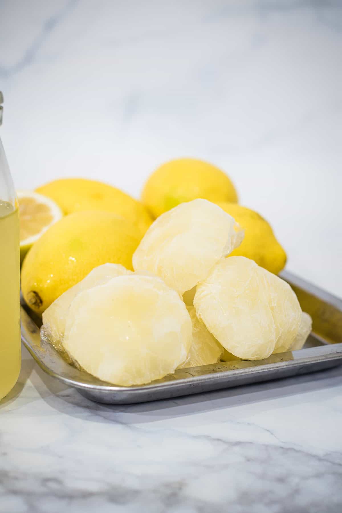 Wrapped frozen lemonade concentrate on a tray