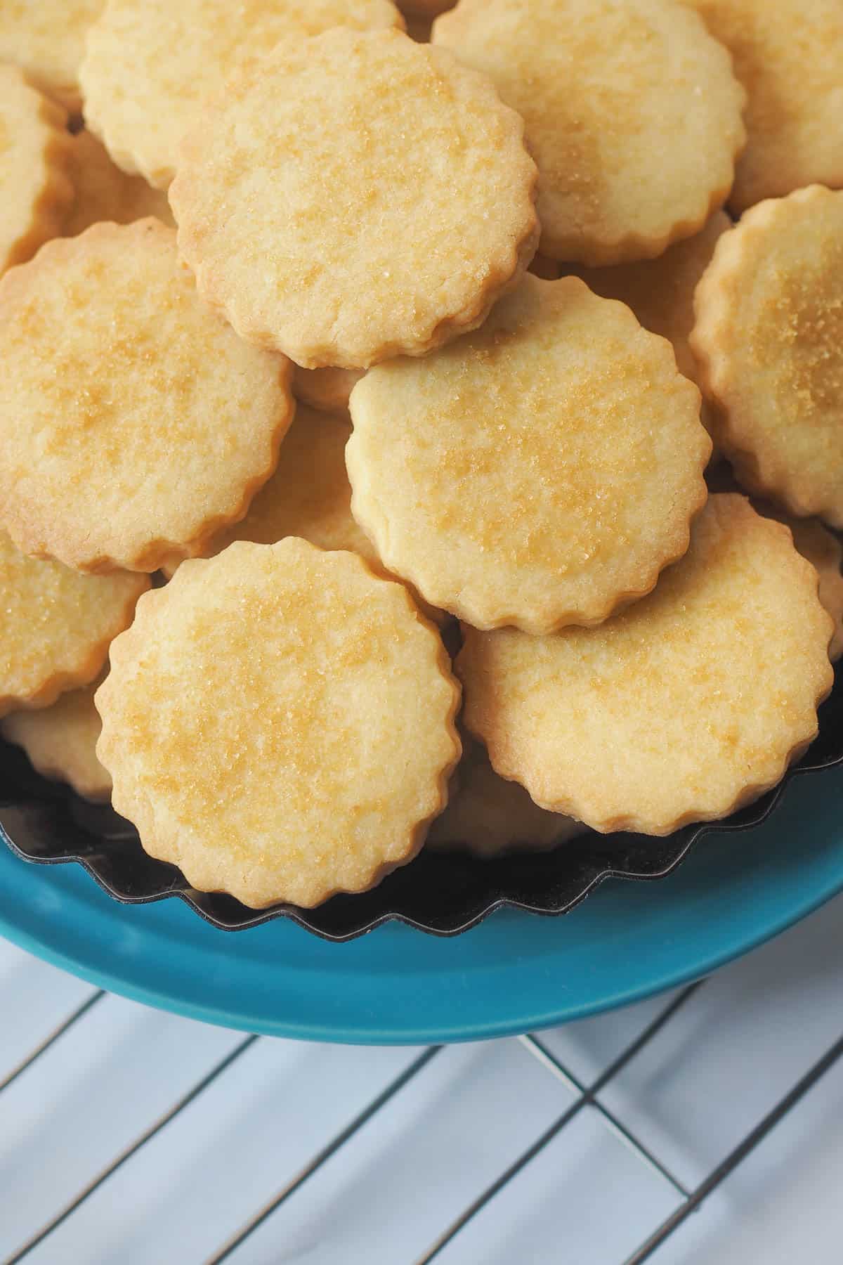 Scalloped cut out cookies in a blue plate