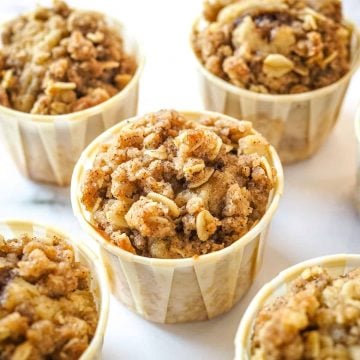 Streusel muffins against marble background.