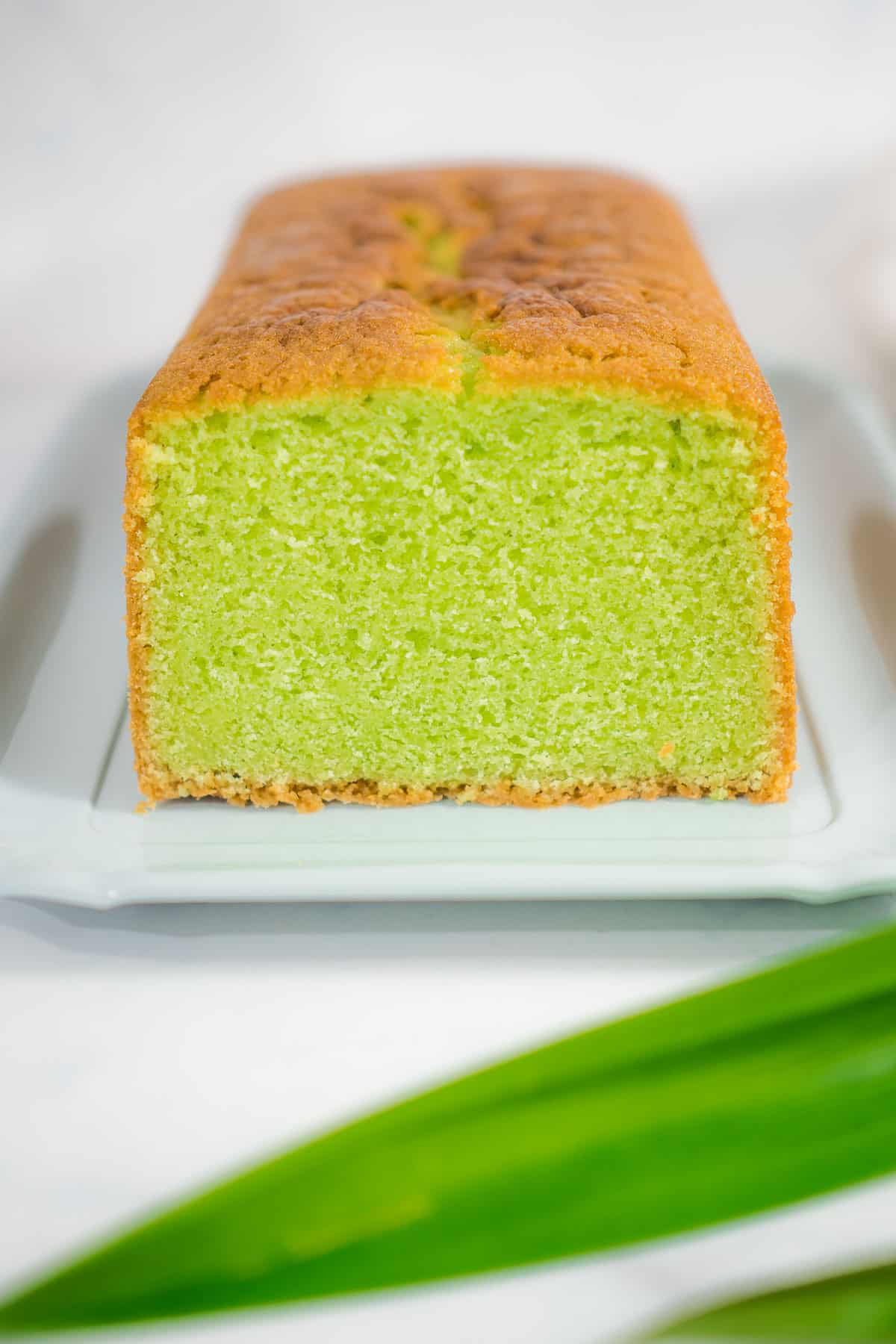 Front view of a cut cake loaf.