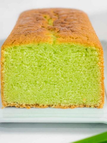 Front view of a cut pandan cake loaf