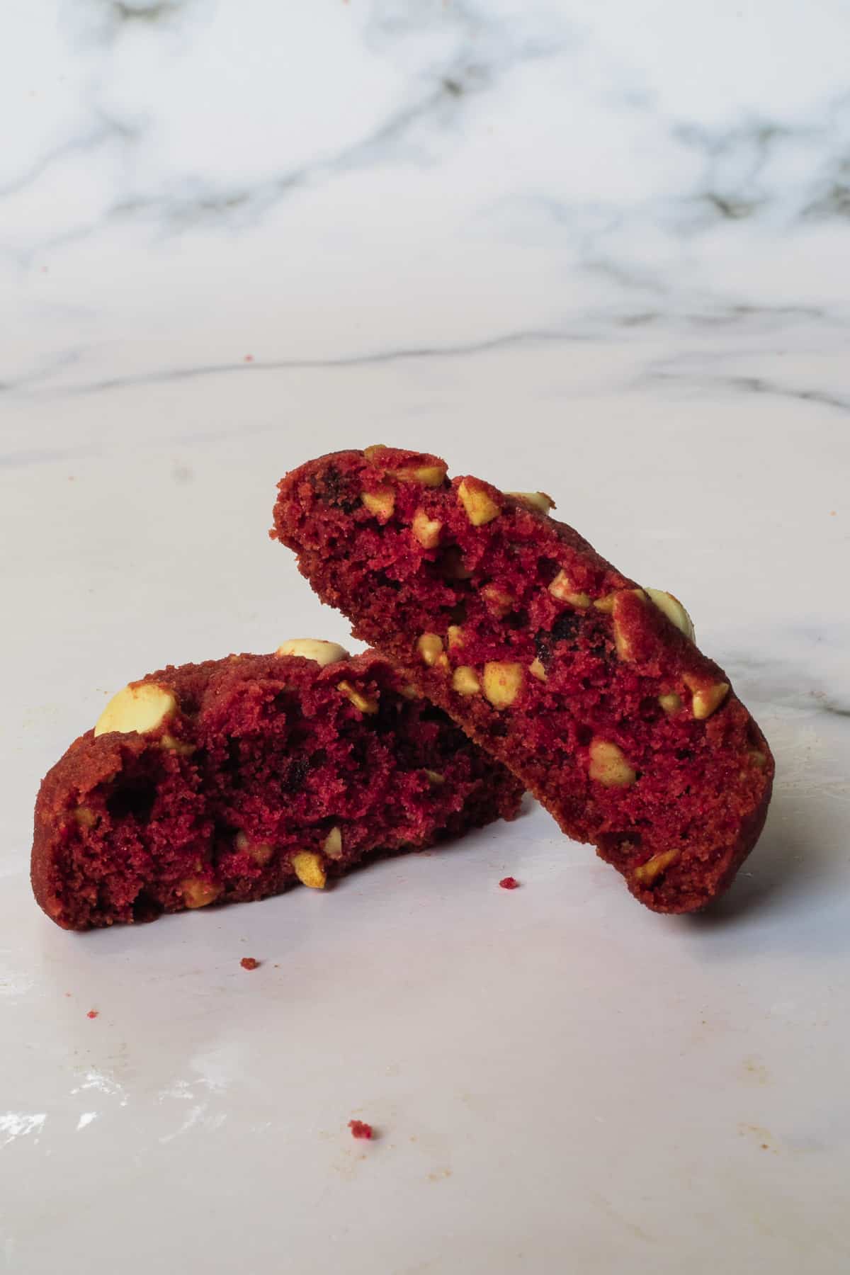 A red velvet cookie broken into half
