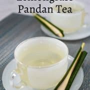 2 cups of drinks with lemongrass and pandan on the saucers