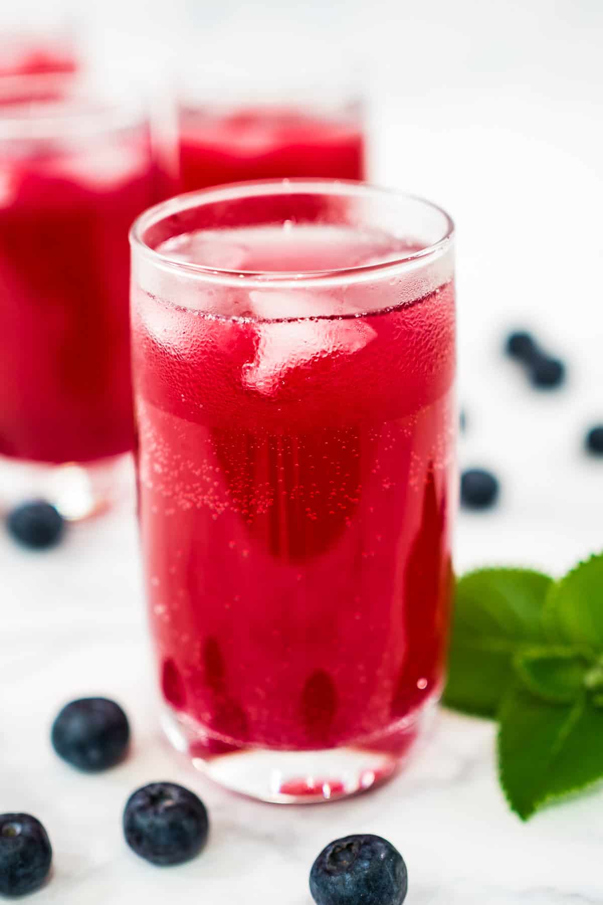 Iced blueberry soda drink in a glass