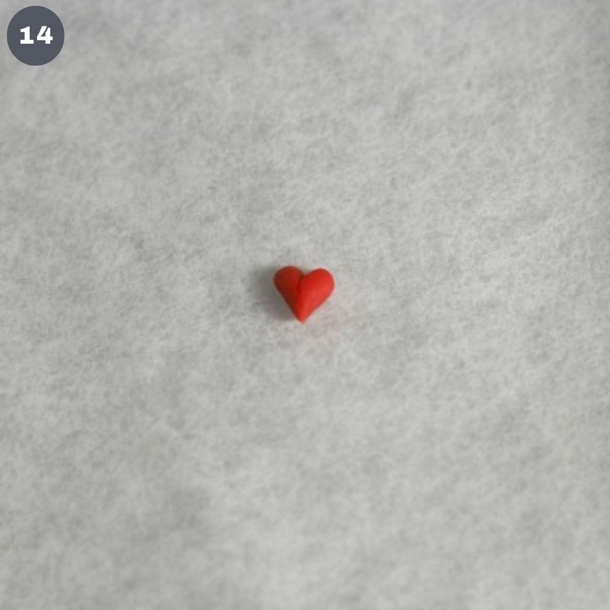 A tiny red fondant heart.
