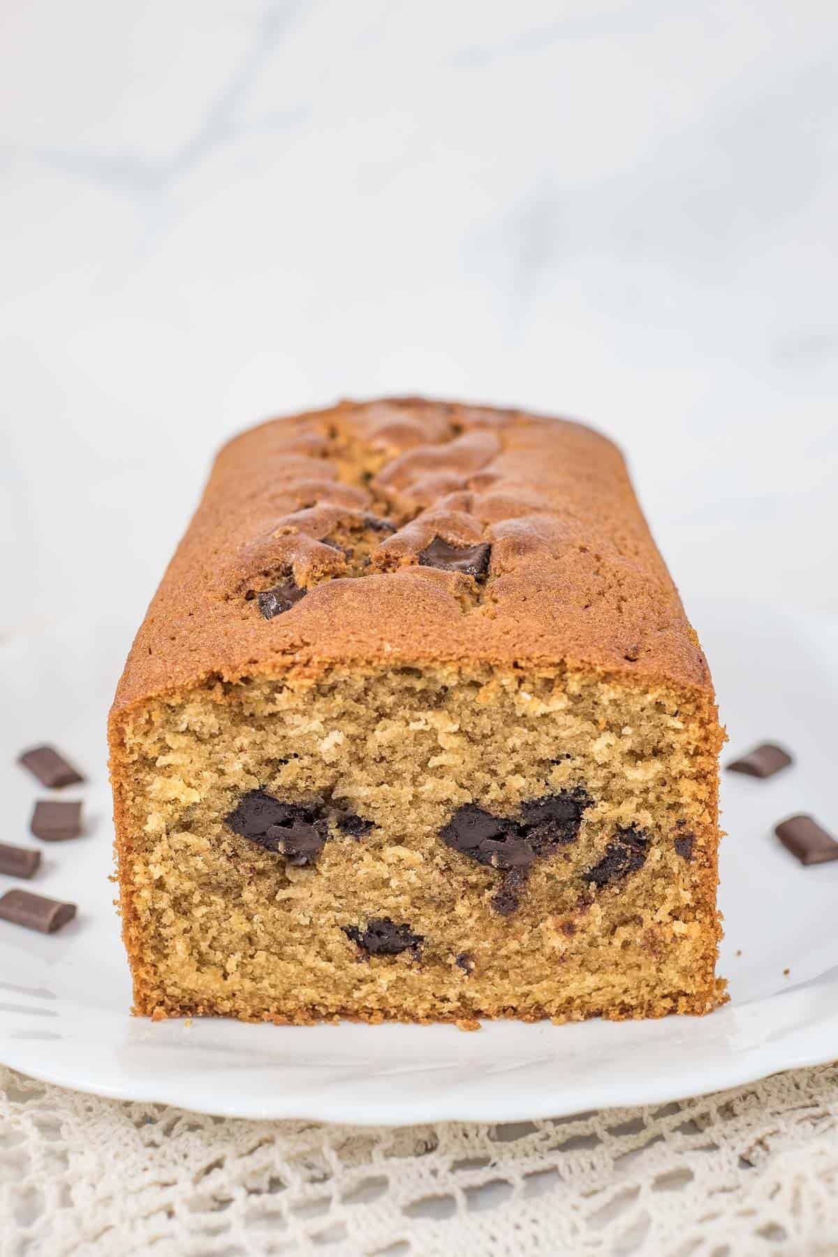 The front view of an instant coffee cake with a slice cut out.