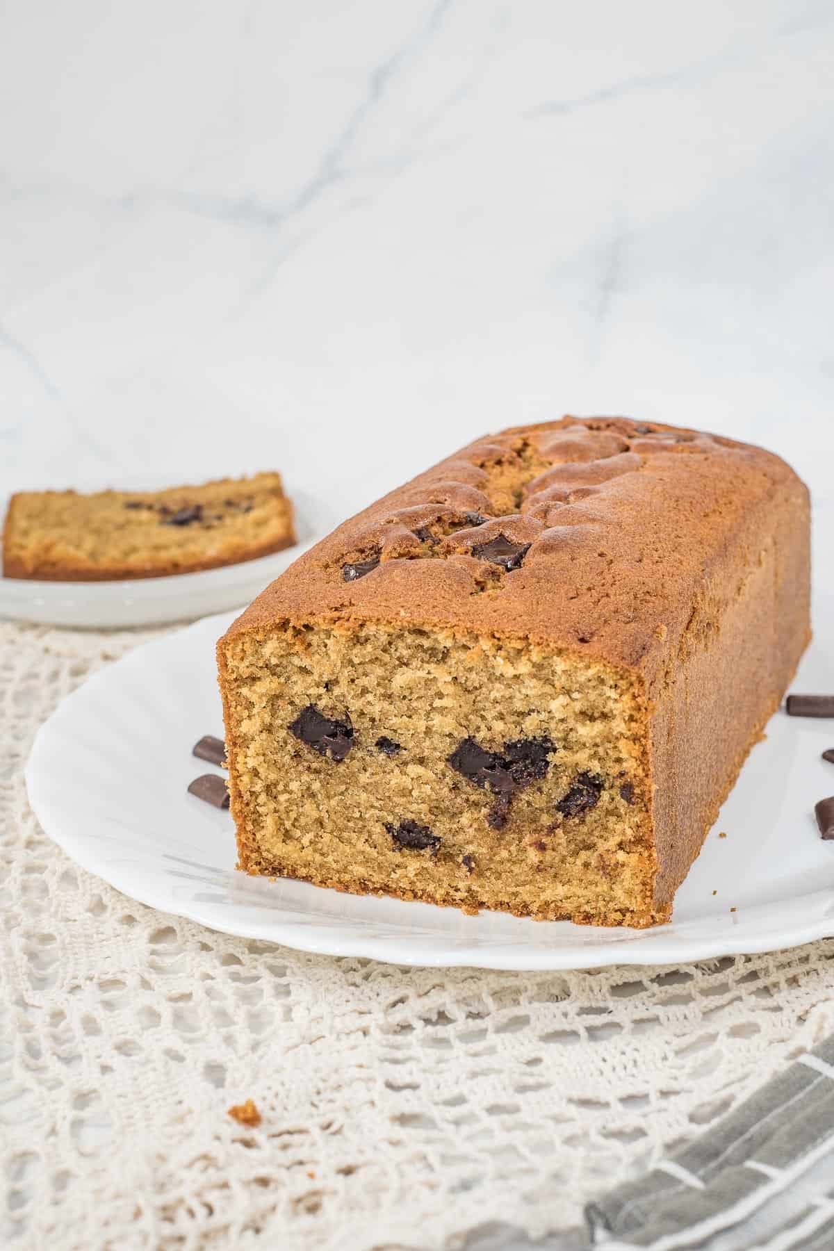 The front view of an instant coffee cake with a slice cut out.