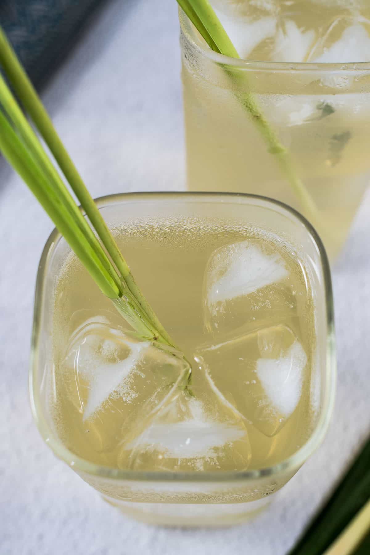 Top view of pandan lemongrass drink in a tall square glass