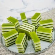 Pandan jelly arranged in a round grey plate.