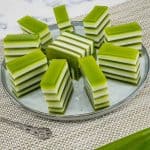 Pandan jelly arranged in a round grey plate.