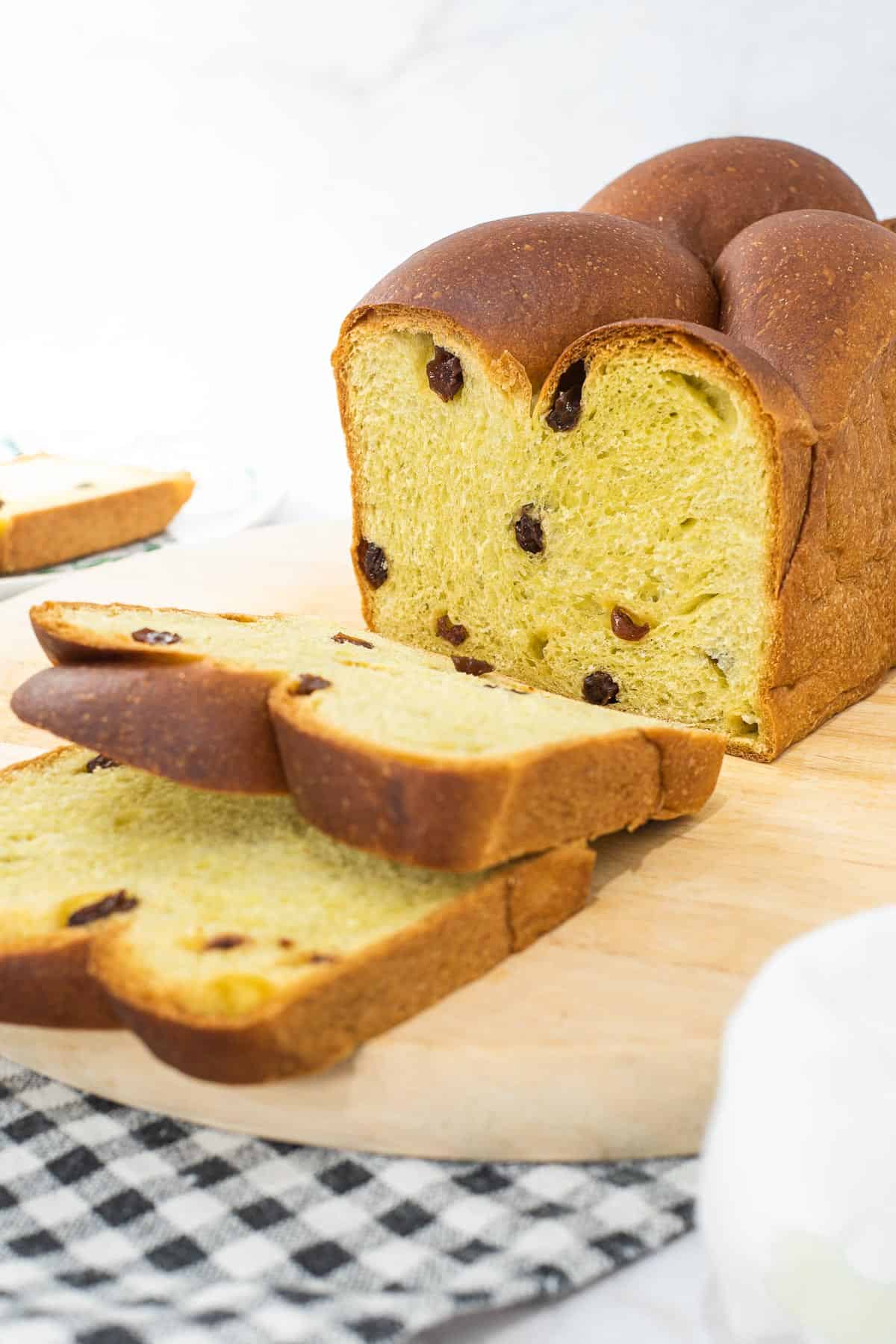 A raisin loaf cut into slices.