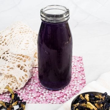 Blue butterfly pea syrup in a bottle.
