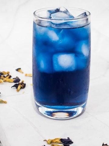 A glass of blue butterfly pea tea.
