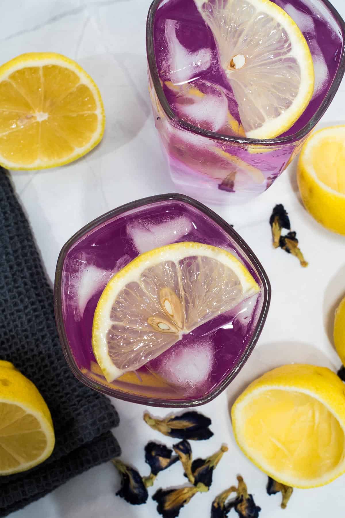 Top view of iced butterfly pea lemonade.