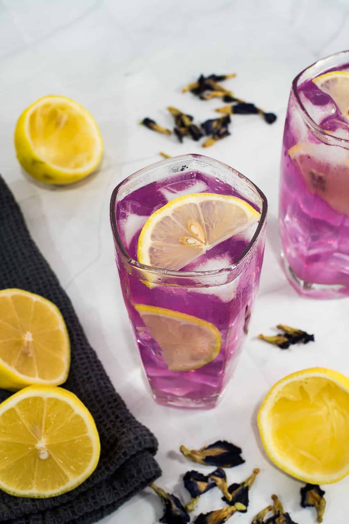 A tall glass of purple lemonade.