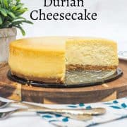 A baked durian cheesecake with a slice cut out.
