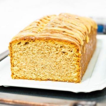 A loaf of cake with glaze topping.