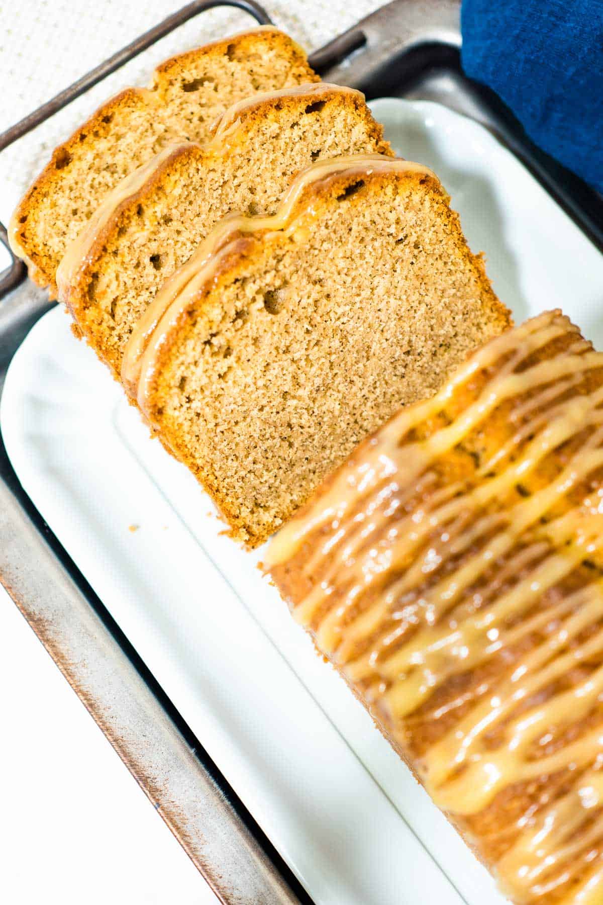 A loaf of cake with glaze topping.