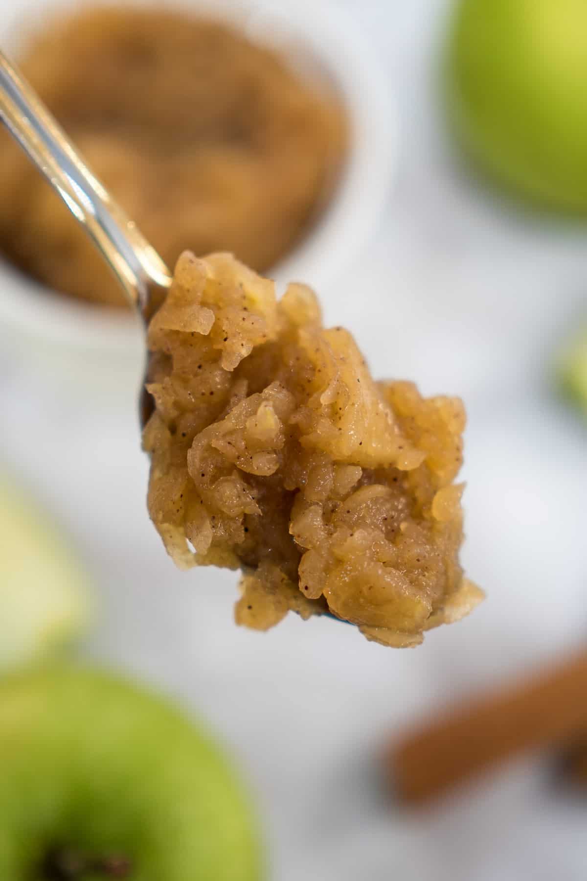 A spoon of apple compote.