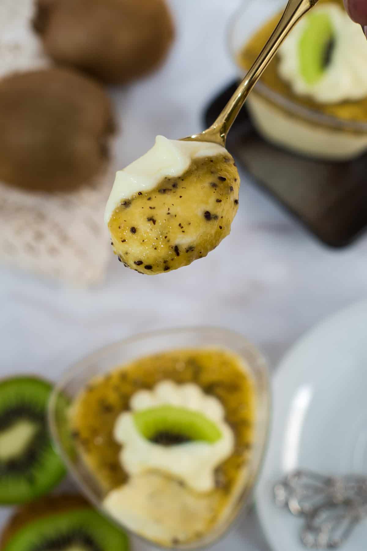 A scoop of kiwi mousse in a small spoon.