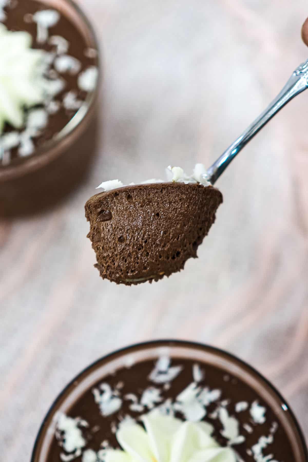 A spoon of chocolate mousse.