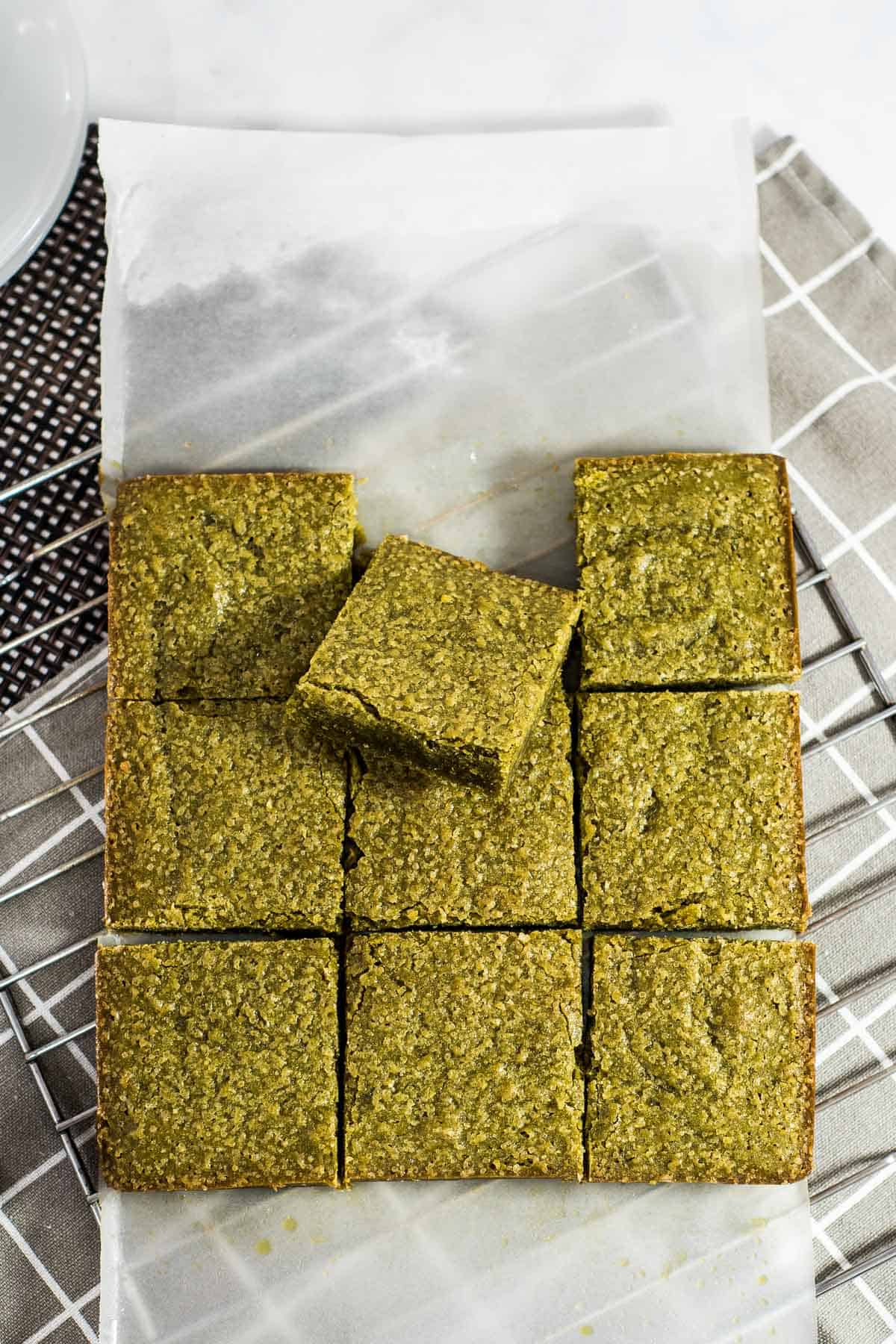 A block of green blondie cut into 9 squares.
