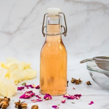 Rose simple syrup in a bottle.