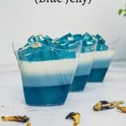 3 cups of layered blue jelly with tiny blue jelly cube topping.