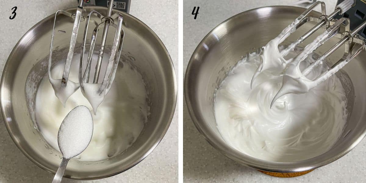 Adding sugar with a spoon into whipped egg whites in a bowl and a bowl of egg whites with stiff peaks formed on the lifted cake beaters.
