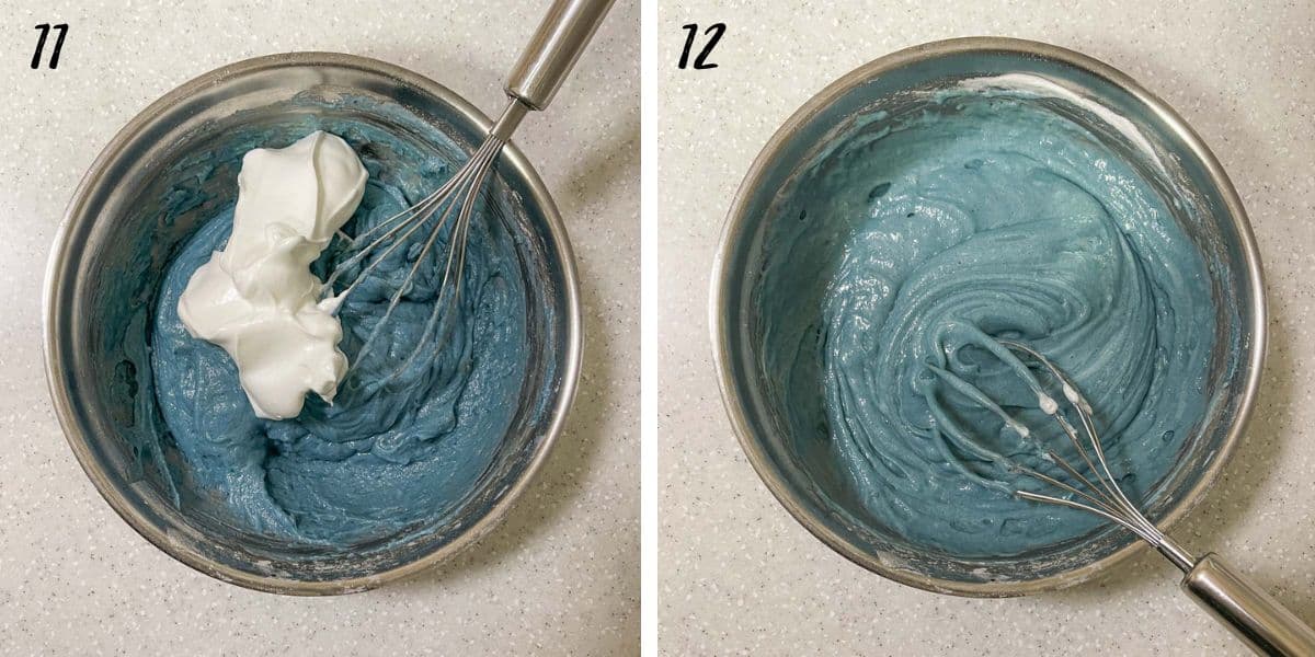 Mixing whipped egg whites into blue cake batter with a hand whisk and a bowl of blue cake batter with a hand whisk in it.