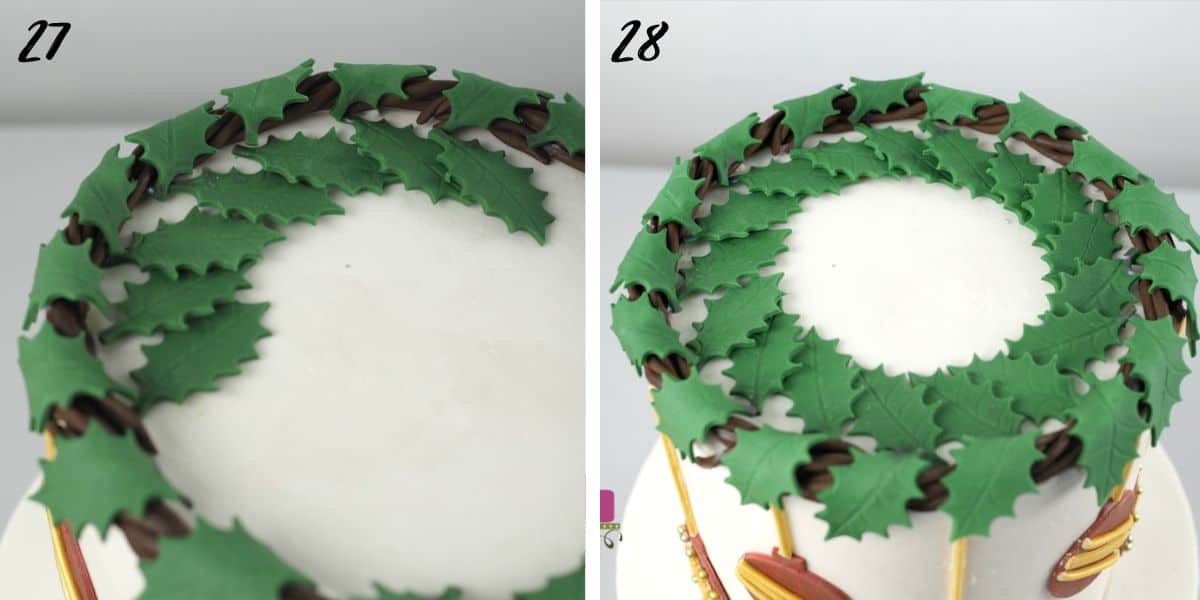 Green holly leaves on top of a white cake.