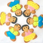 Gingerbread boys and girls cookies in a circle.