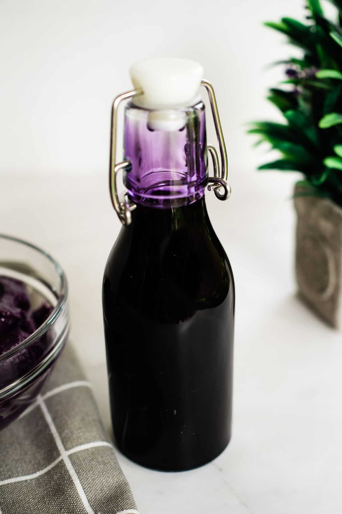 A bottle of purple syrup.